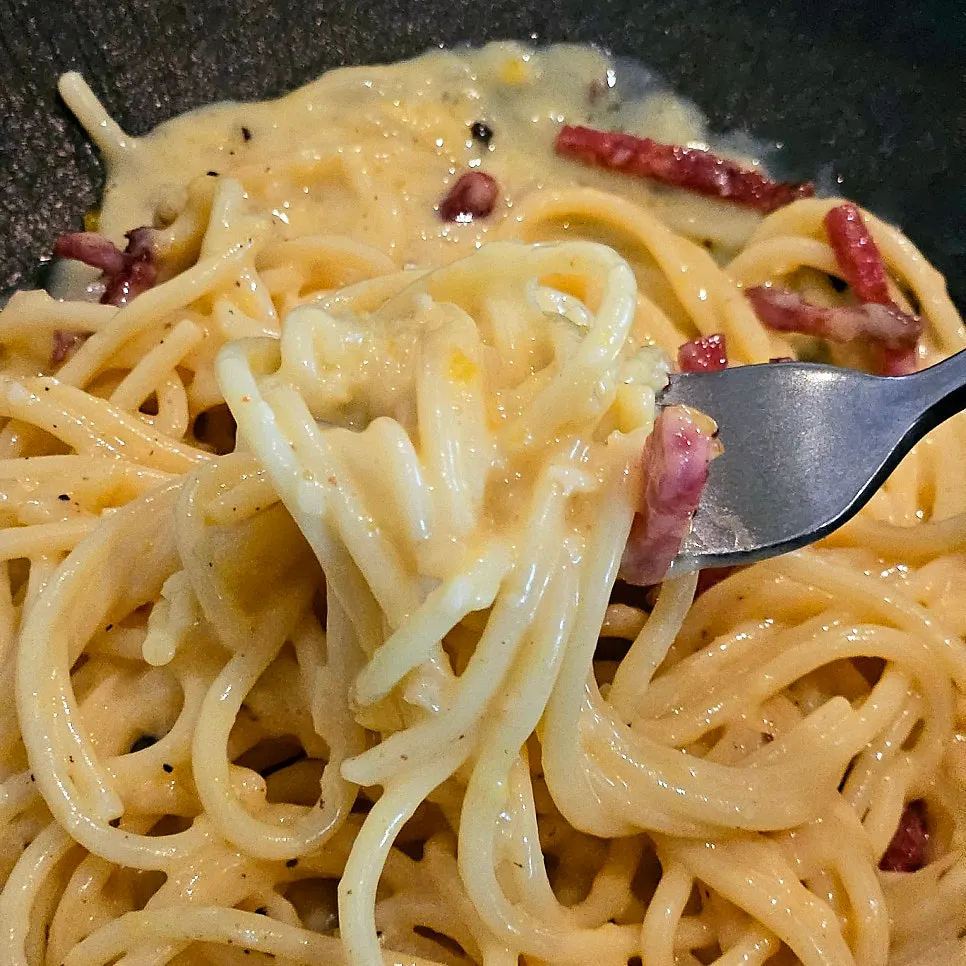 Pasta noodles coated in thick sauce