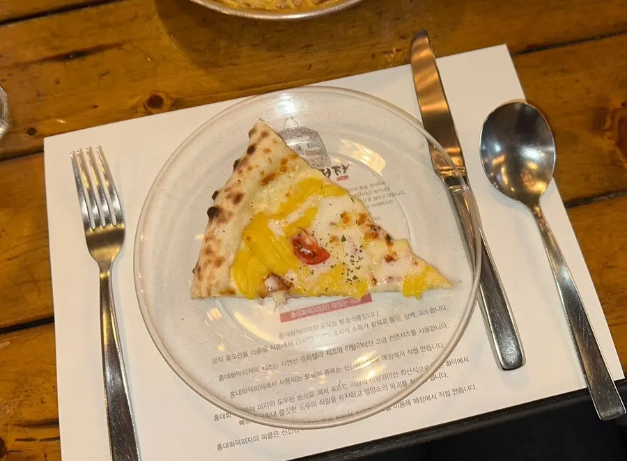 Sweet potato wood-fired pizza kept warm over a candle