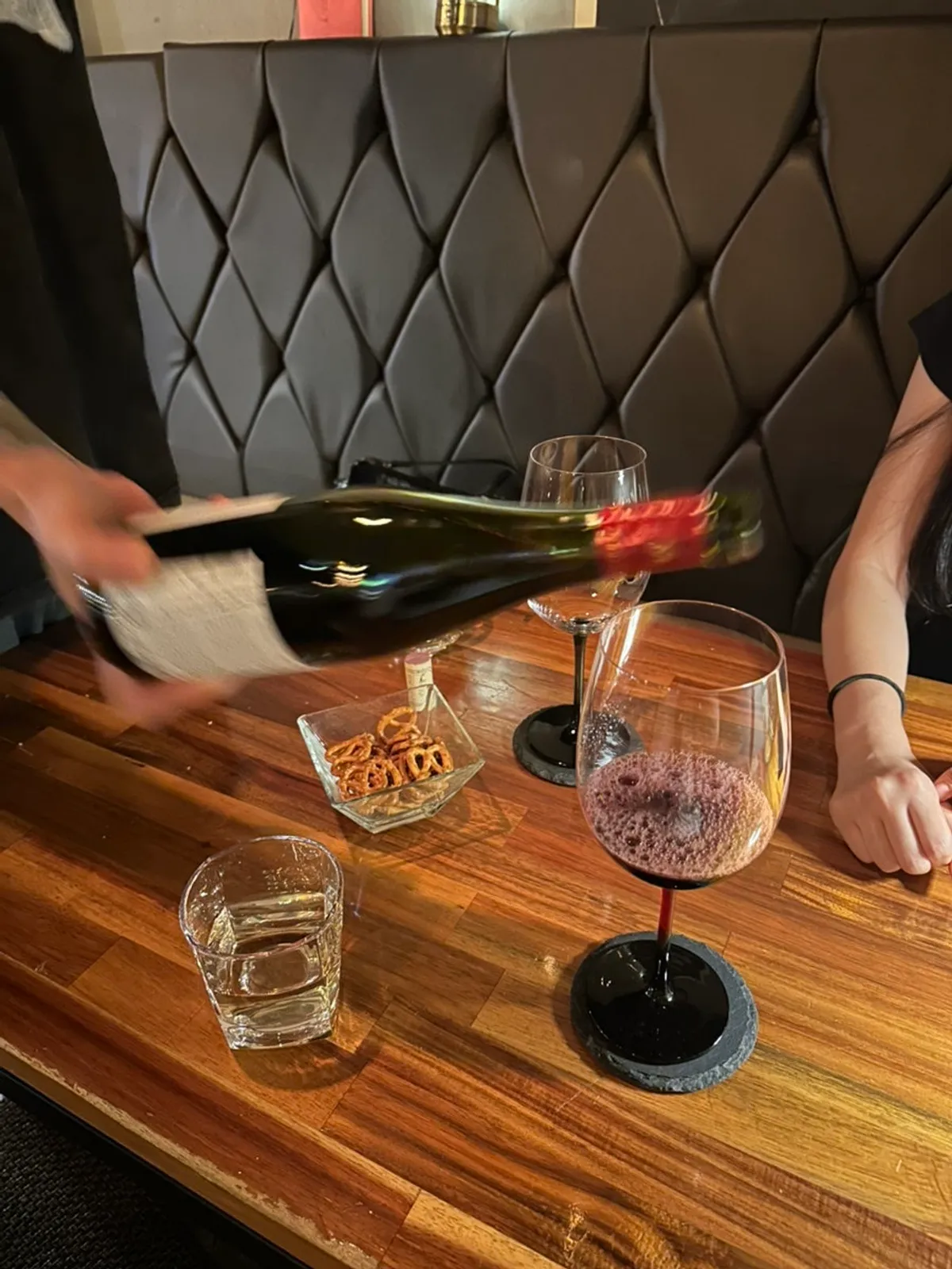 Red wine being poured into a glass