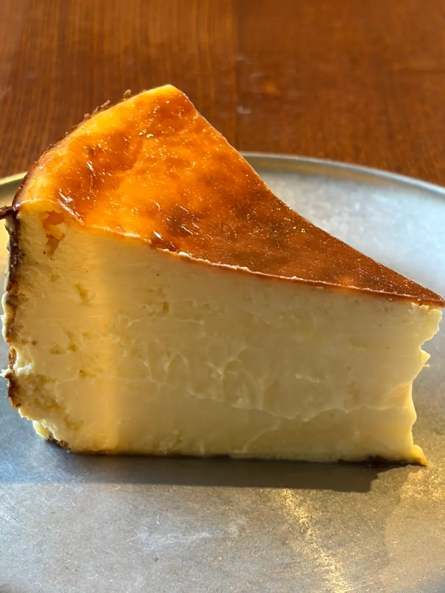 Cross-section of the Basque cheesecake cut with a fork