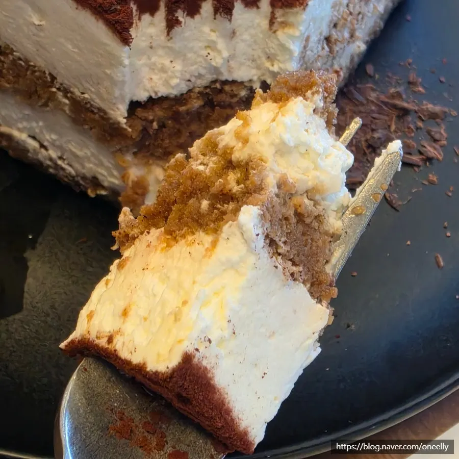 Tiramisu and brewed coffee placed together on the table