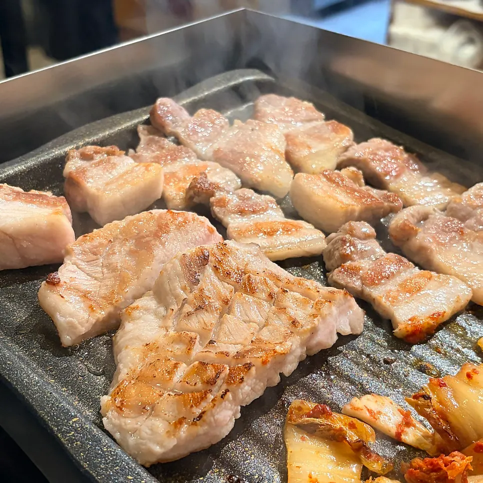 Meat browning on the grill