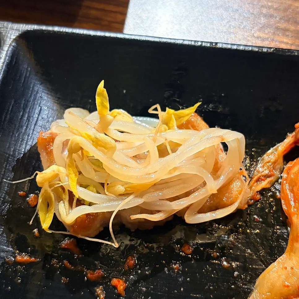 Meat served with kimchi and bean sprouts