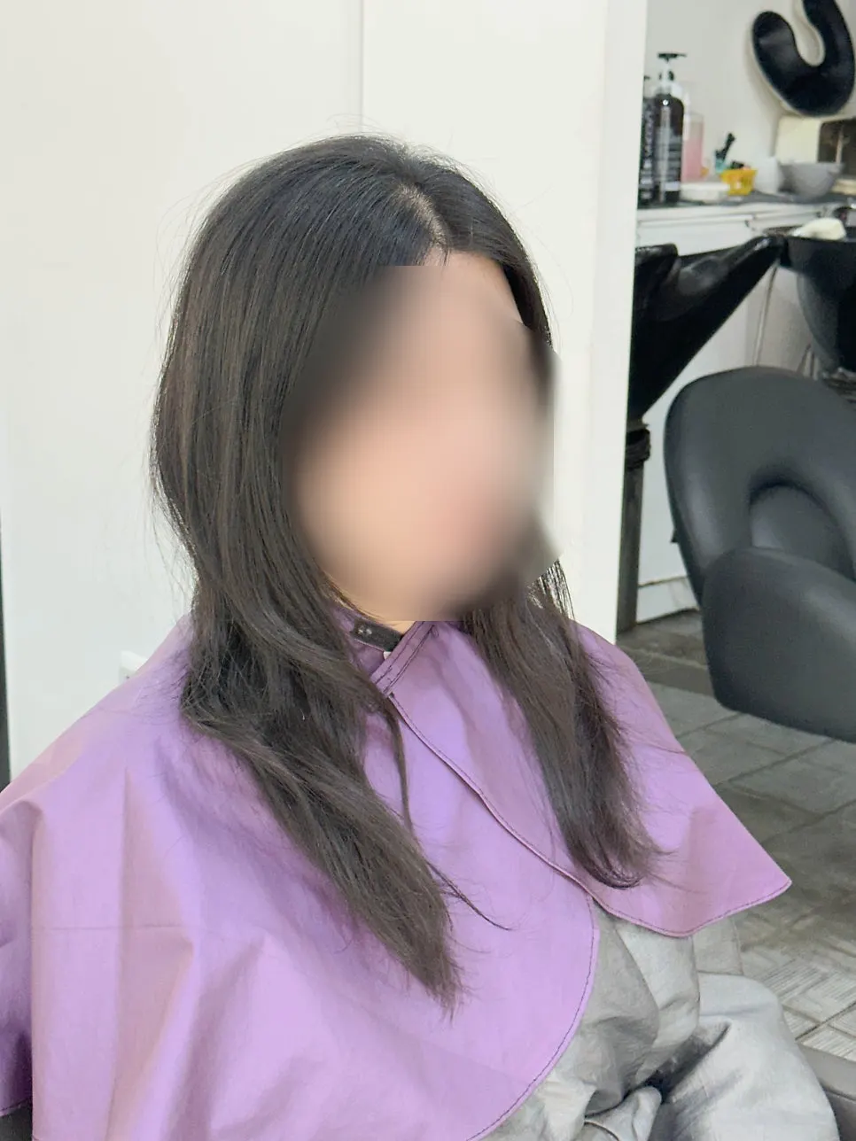 Hair rolled with large rods during the perm service