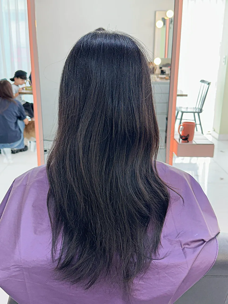 Long hair styled with a build perm for a fall mood