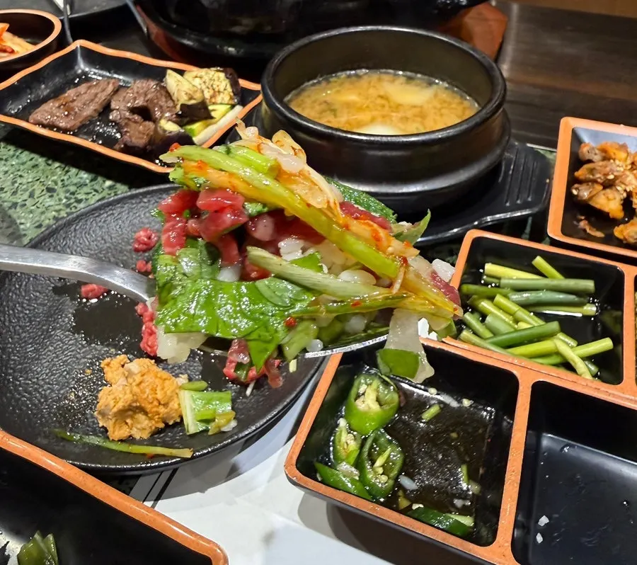 Doenjang jjigae served bubbling in a stone pot