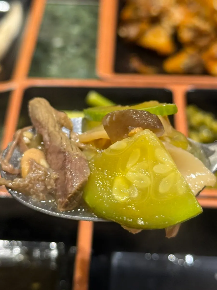 Table with meal dishes and grilled meat together
