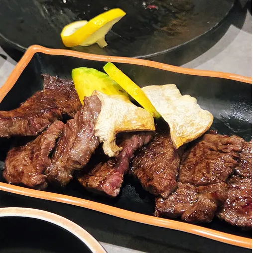 Staff grilling hanwoo for the table