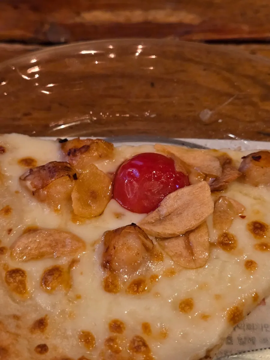 Slice of Quattro Formaggi drizzled with honey