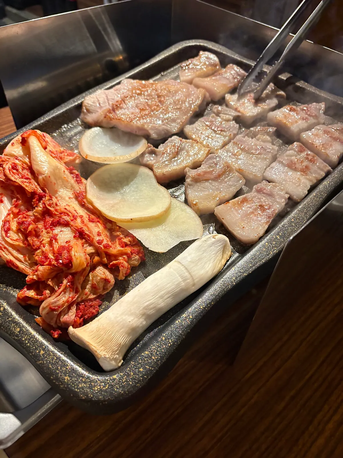 Thick pork belly and pork jowl on the grill