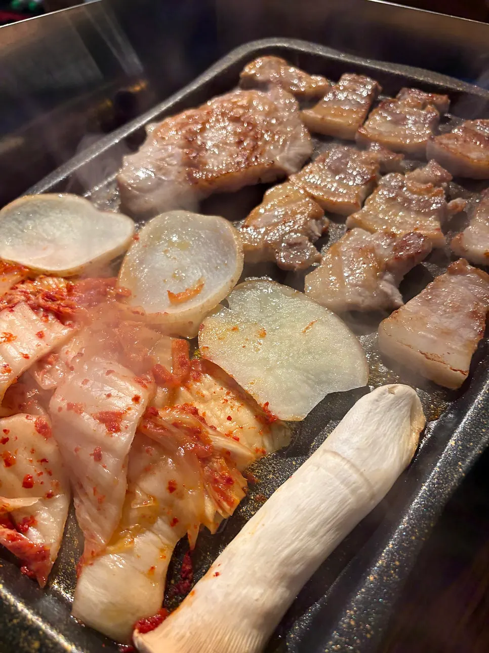 Grill with kimchi, potato, and mushroom cooking together