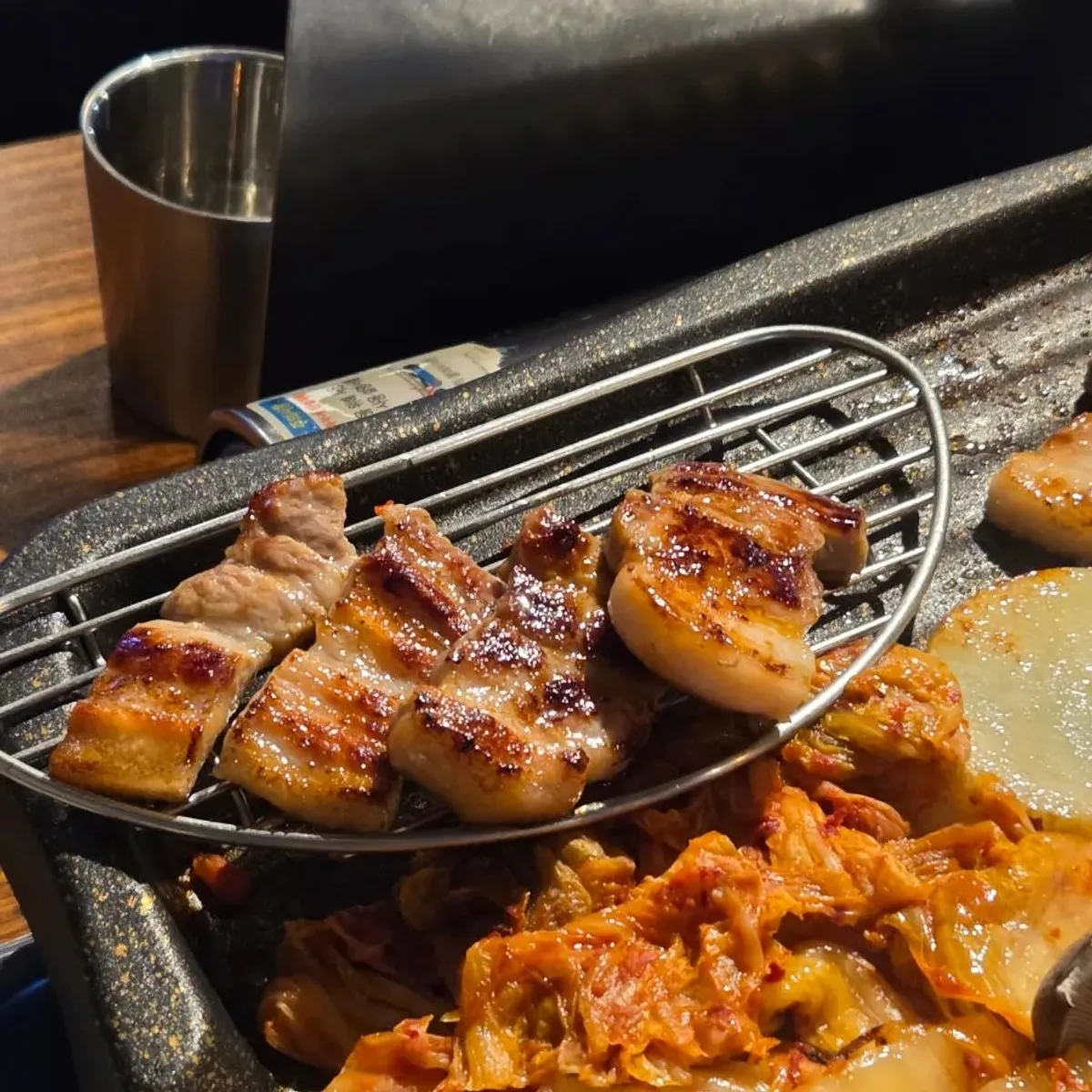 Staff grilling the pork belly directly