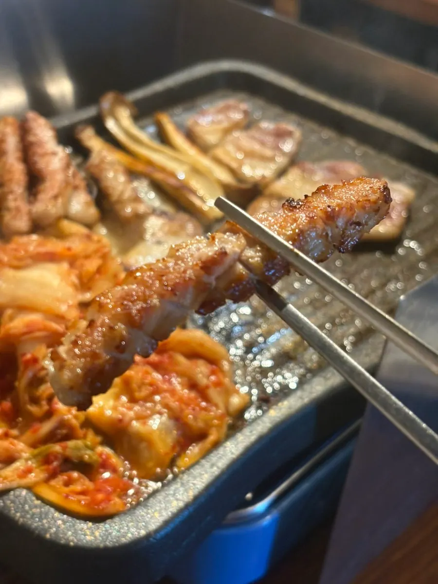 Pork belly and pork jowl together on the grill