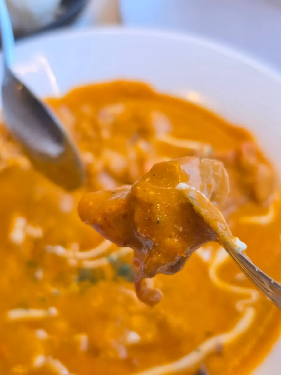 Eating the fries together with the curry
