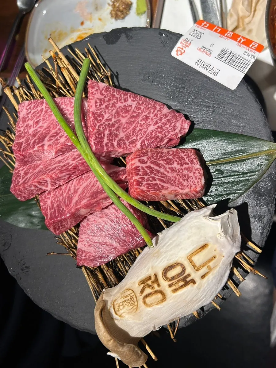 A plate of raw hanwoo 1++ sirloin cap