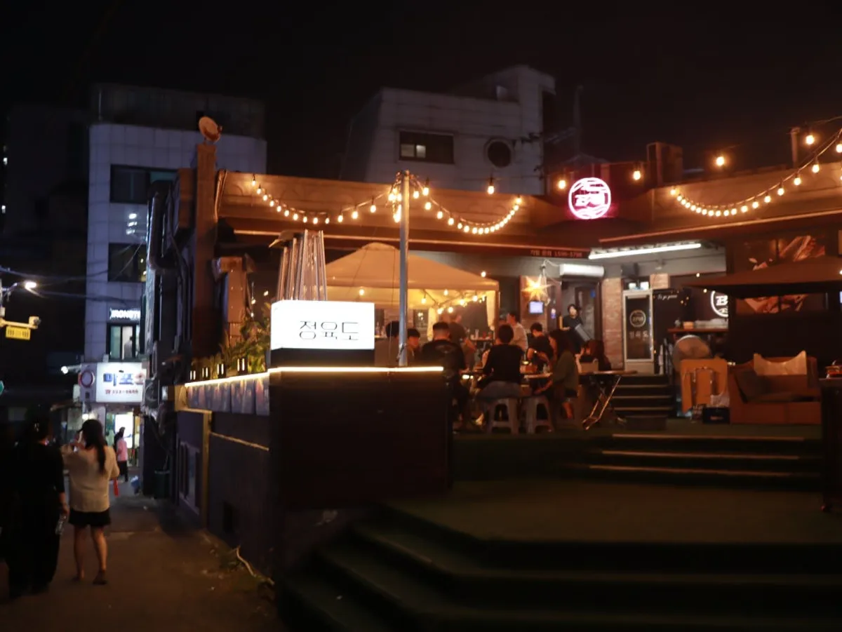 Jeongyukdo's outdoor tables strung with lights