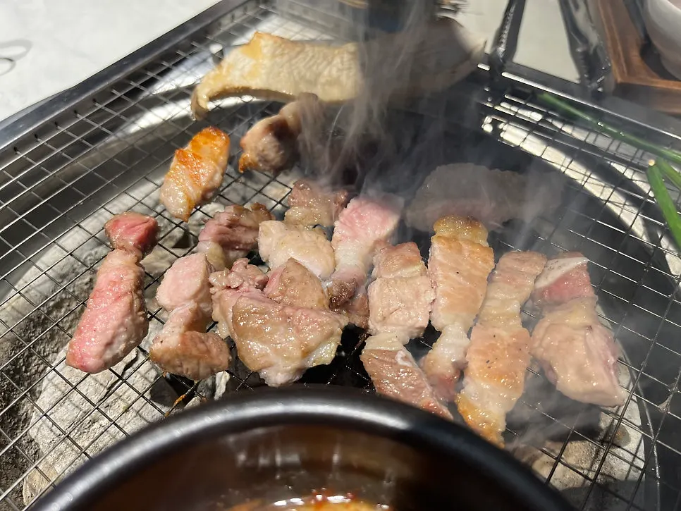 Fresh pork ribs cooking on the grill