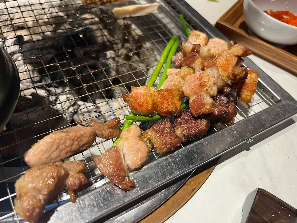 Fresh ribs grilling alongside the Gijang meljeot hot pot
