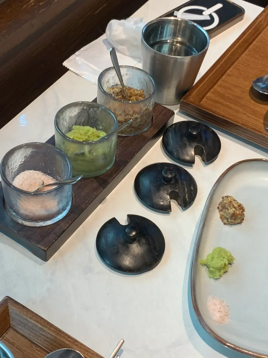 Table sauces including salt, wasabi, and whole grain mustard