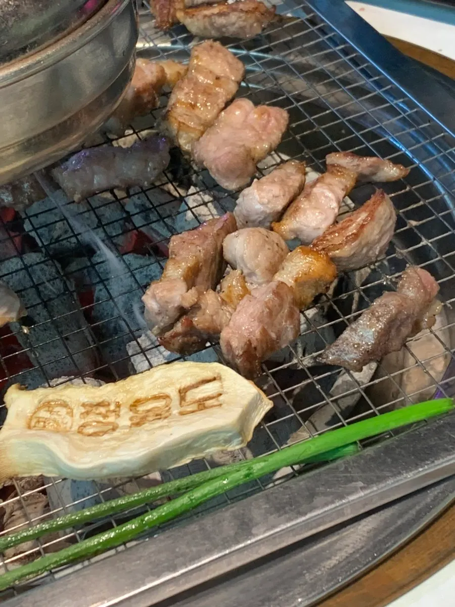 The whole Hanwoo pork set laid out on the wide grill plate