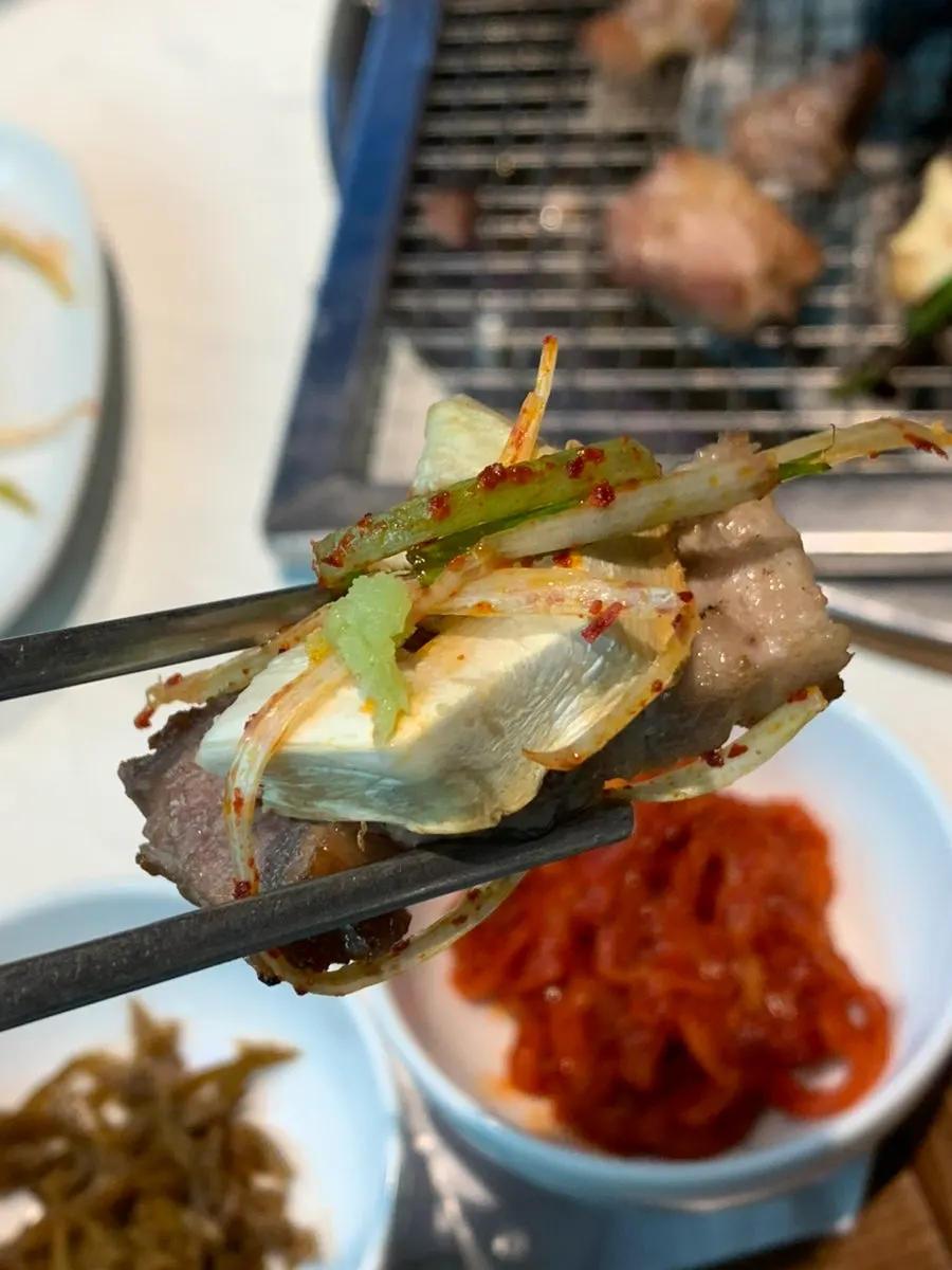 Mushrooms grilling on one side of the plate