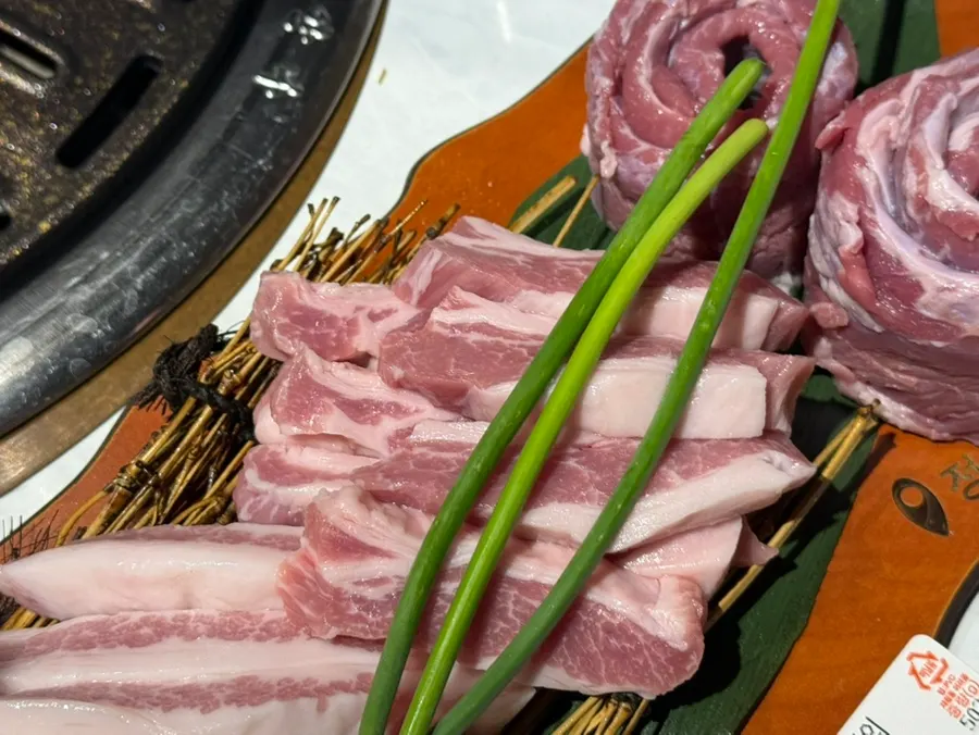 Korean pork specialty cuts placed on the grill