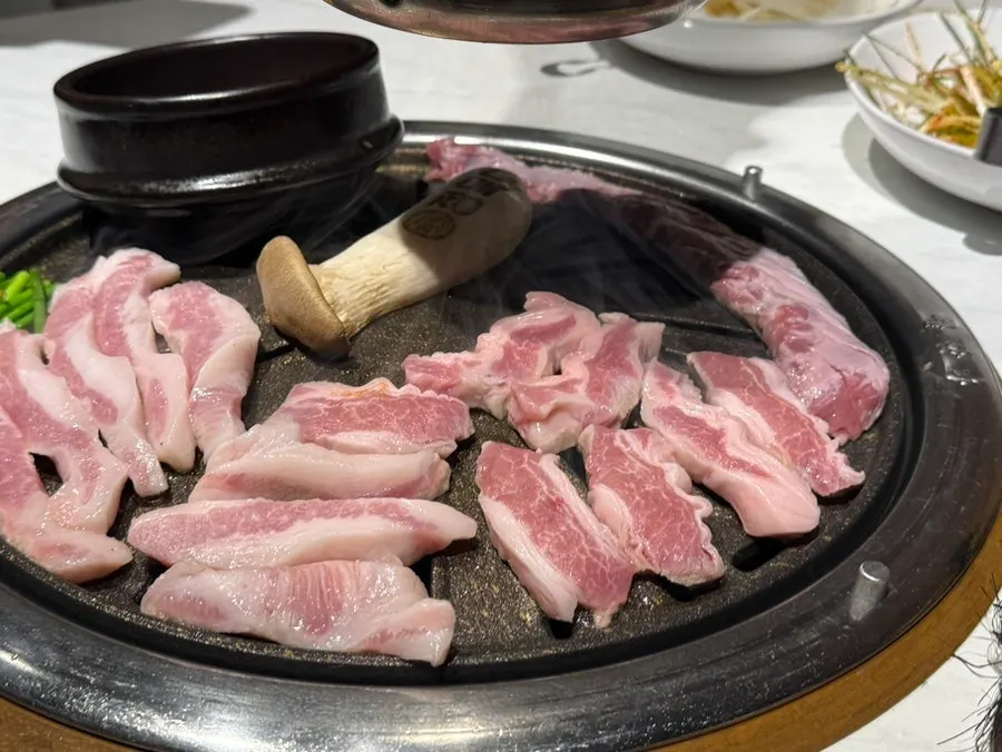 Close-up of grilling pork jowl