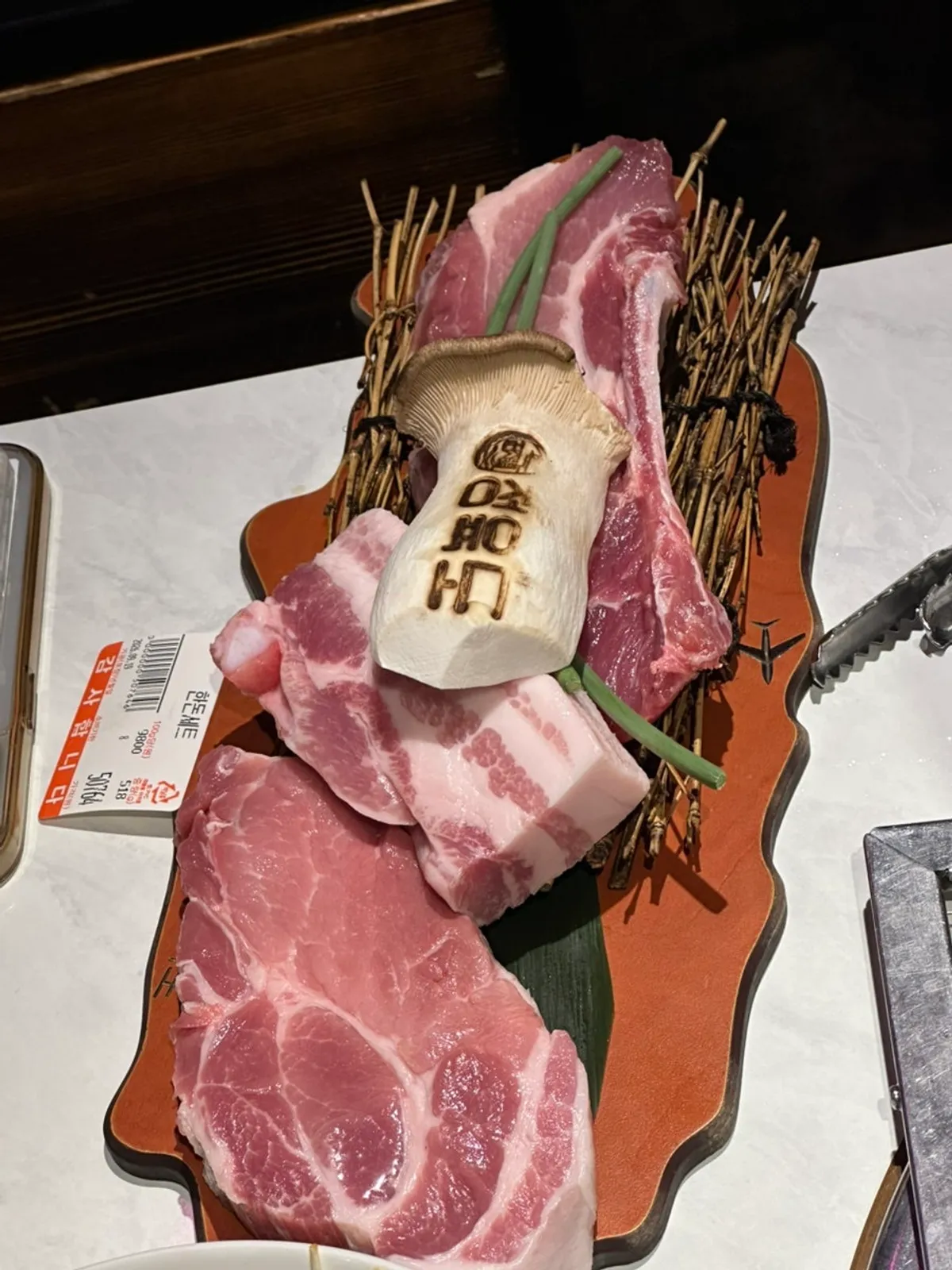 Korean pork grilling over the charcoal at Jeongyukdo