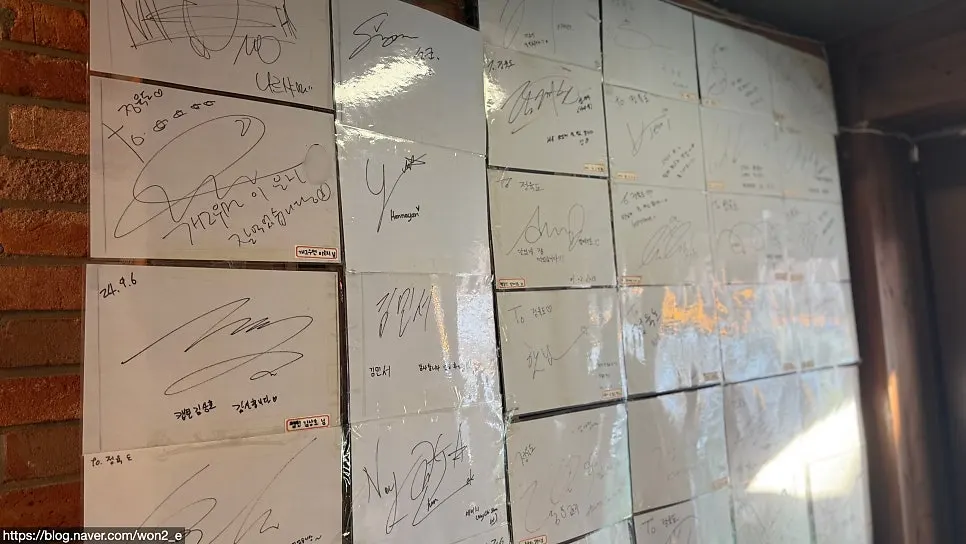 Wall covered with celebrity autographs