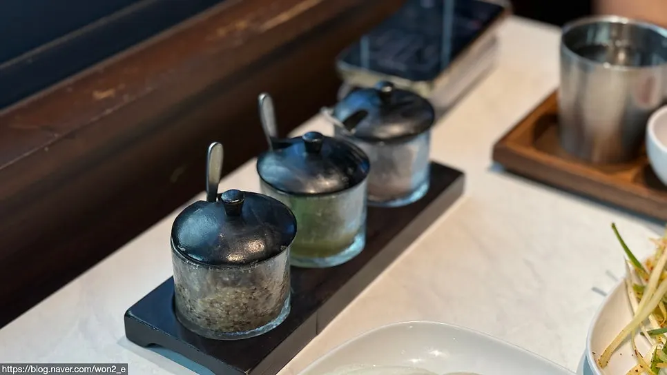 Fresh wasabi, salt, and mustard set on the table