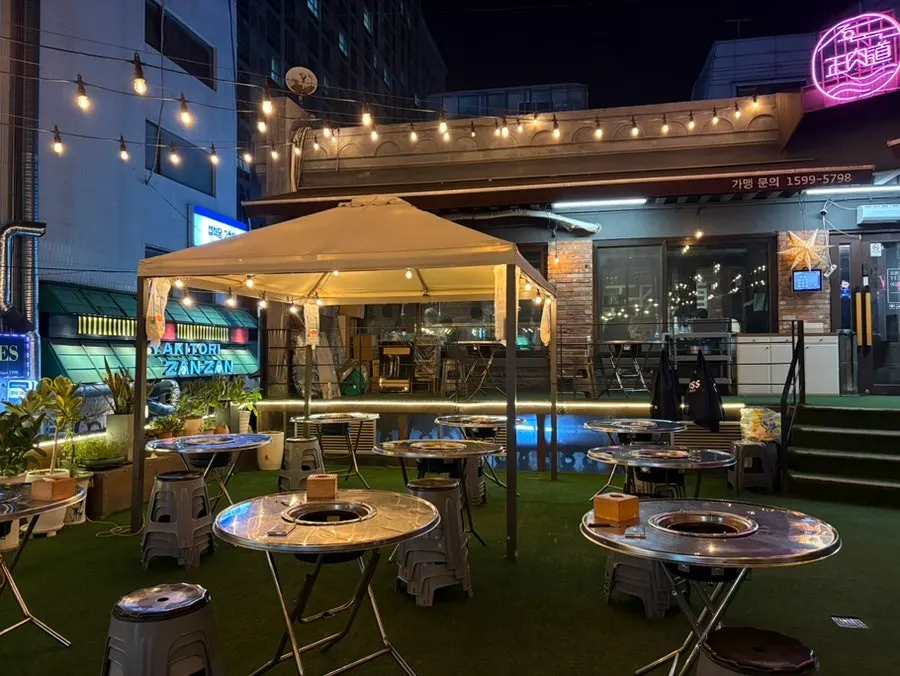 Jeongyukdo's exterior and terrace lit up in the evening near Hapjeong Station