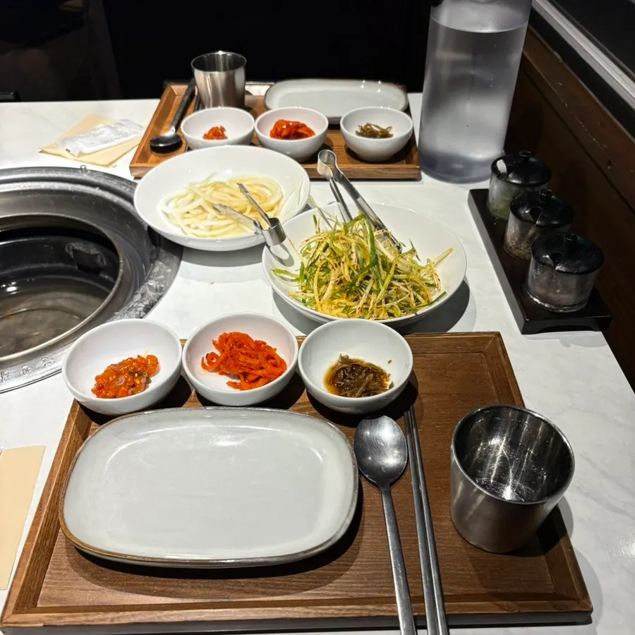 Basic side dishes served as a full spread at Jeongyukdo