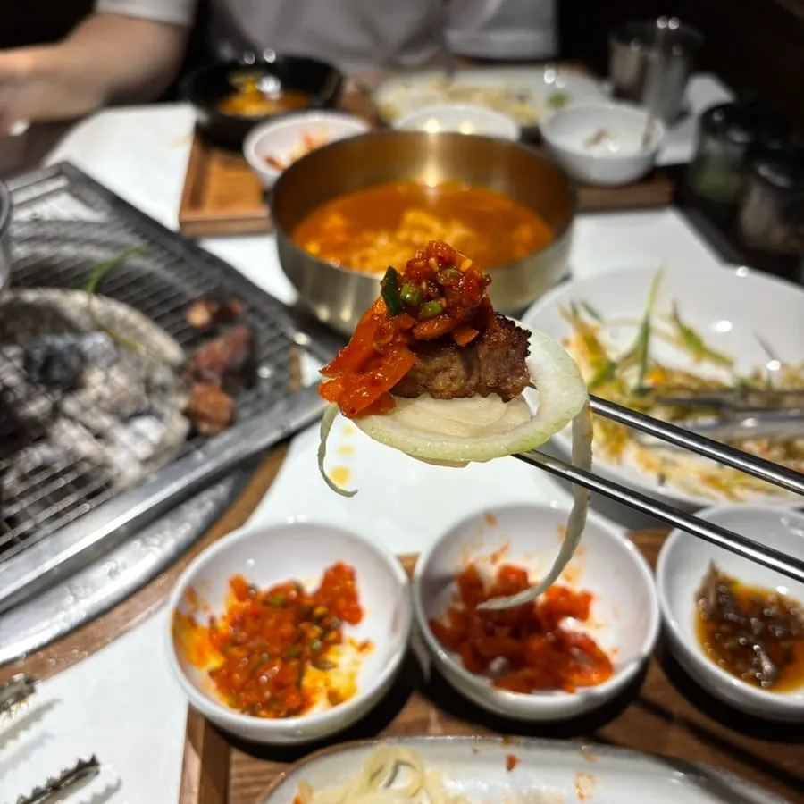 A plate of pork ribs served with side dishes