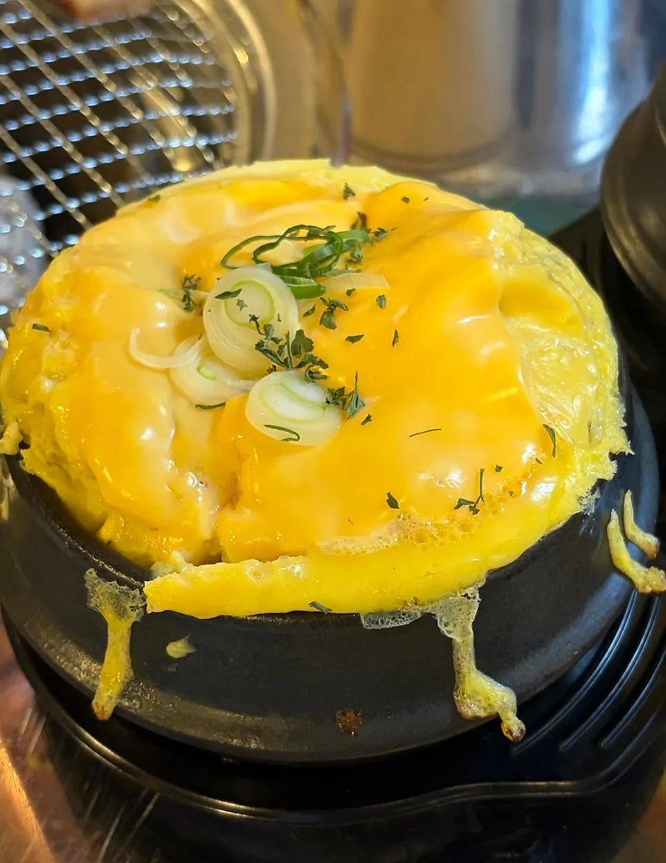 A hot pot of cheese-topped steamed egg custard