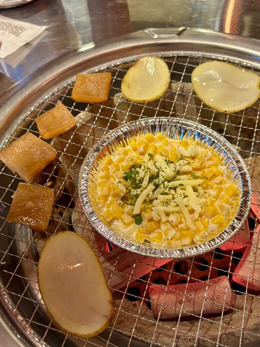 Potato, honeycomb tripe, corn cheese, and chicken porridge grilled over charcoal
