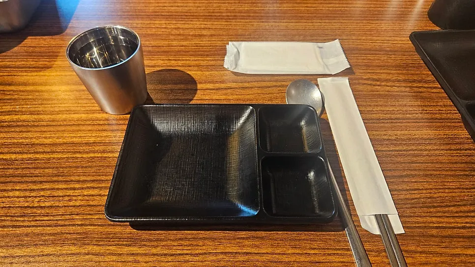 Basement-level restaurant interior packed with customers