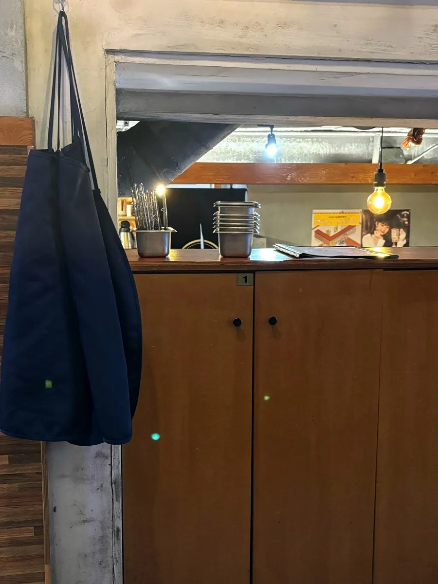 Cabinet for storing bags away from oil splatter