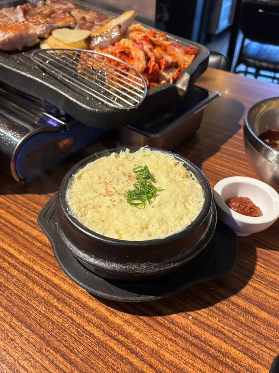 Fluffy steamed egg served in a large earthenware pot