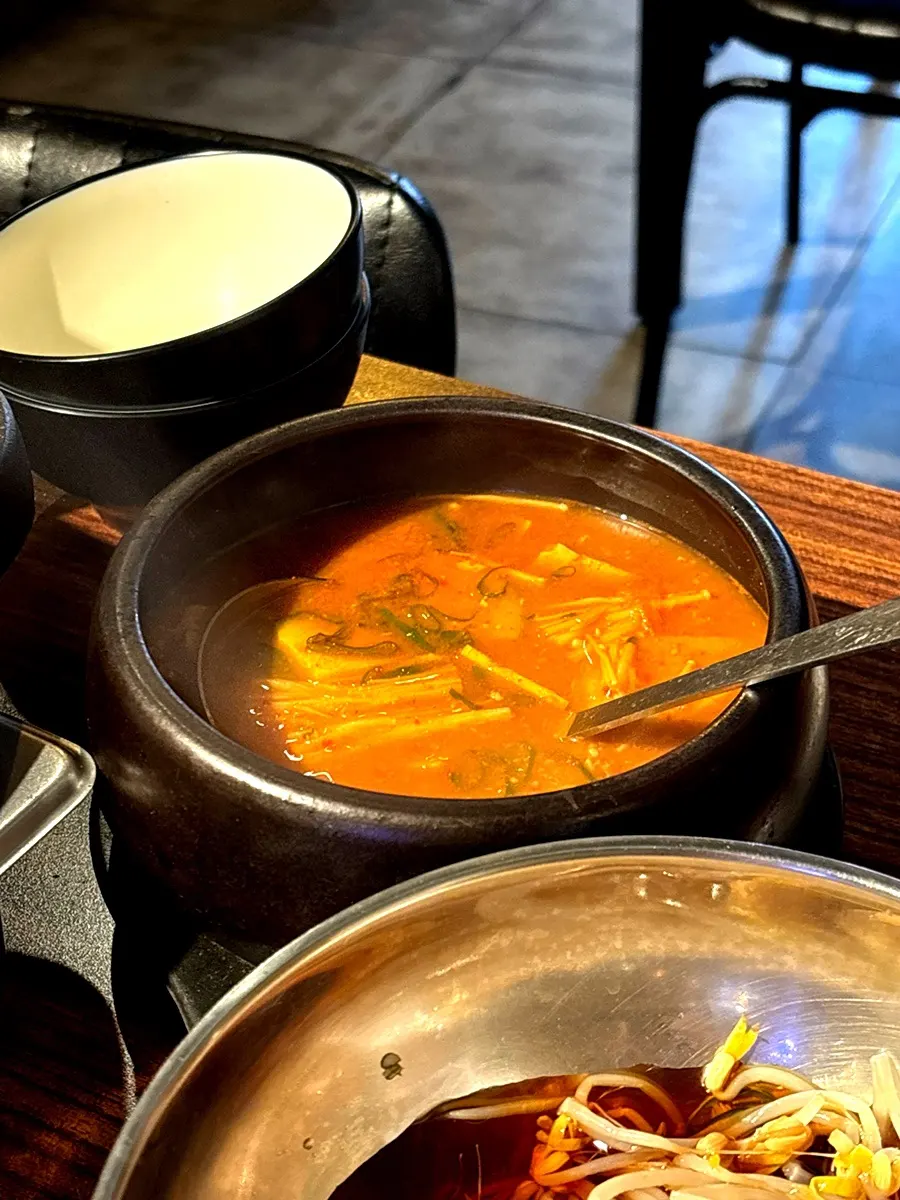 Doenjang jjigae loaded with ingredients, served with rice