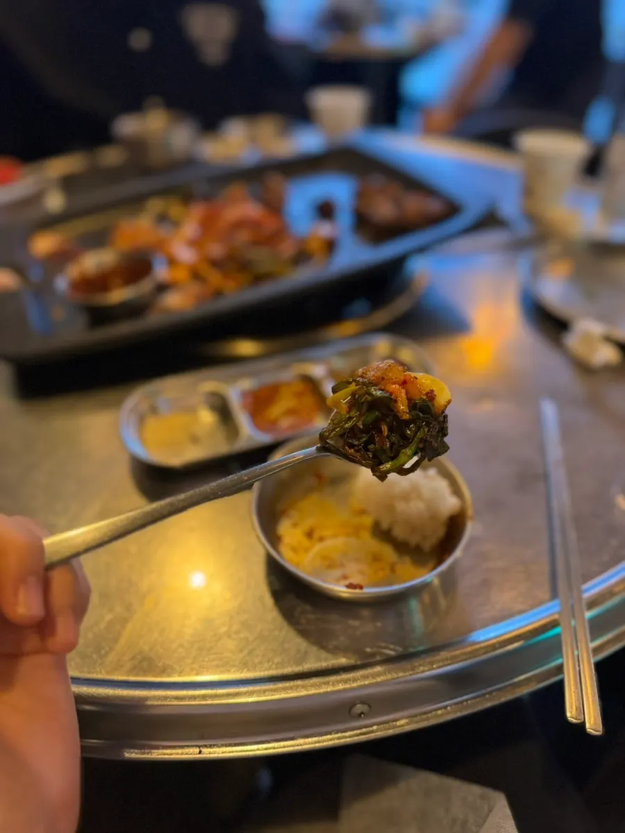 An assortment of banchan served alongside the meat