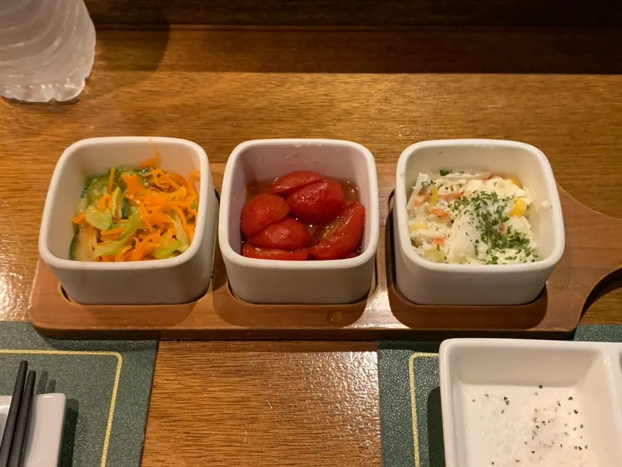 Basic side dishes including sautéed carrot and zucchini, and pickled cherry tomatoes