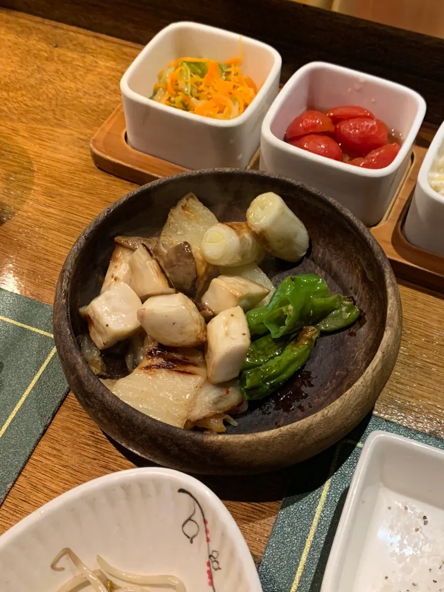 Grilled mushrooms, kkwarigochu peppers, and scallions among the assorted vegetables