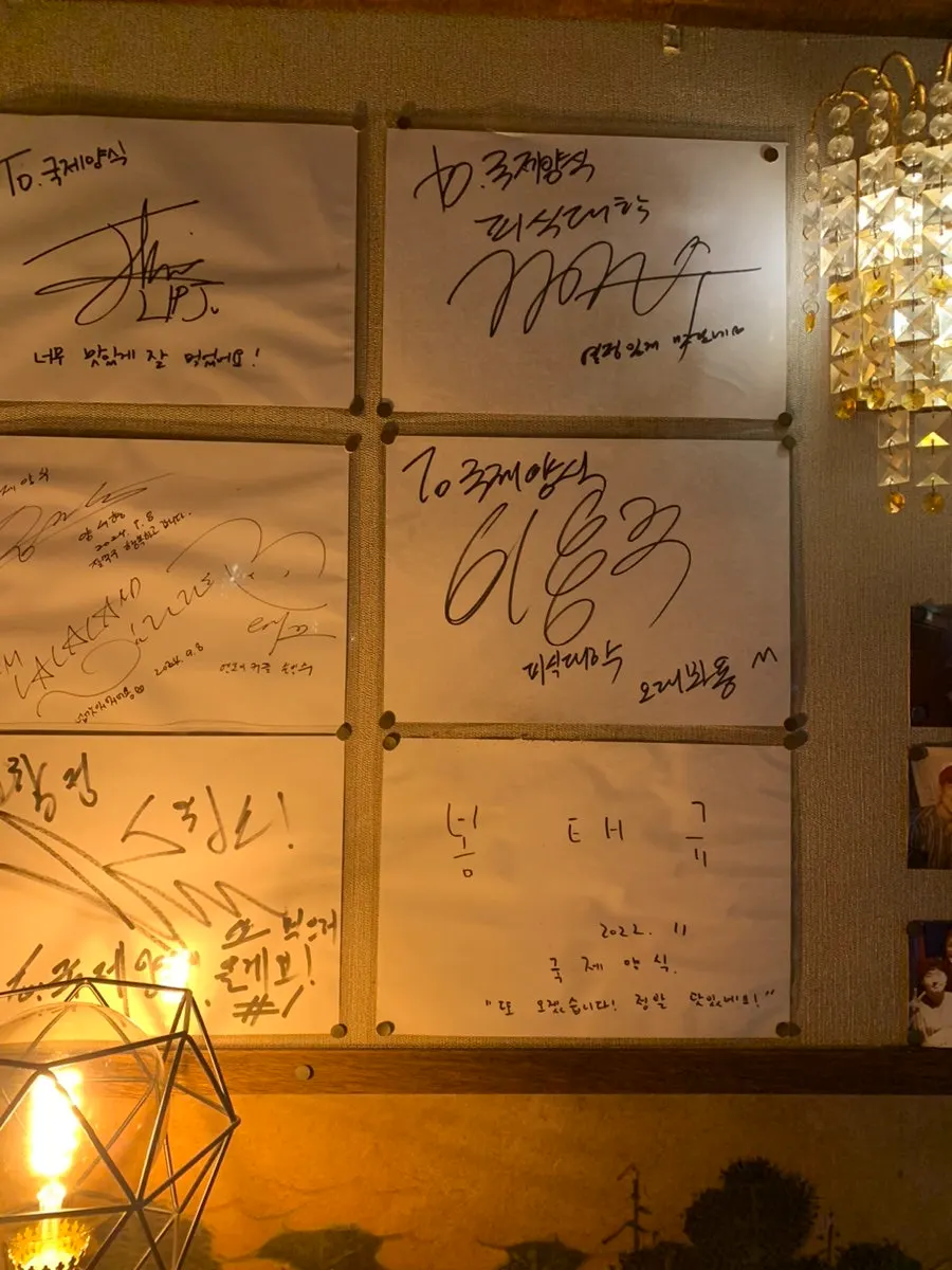 Celebrity autographs displayed on one wall of the restaurant
