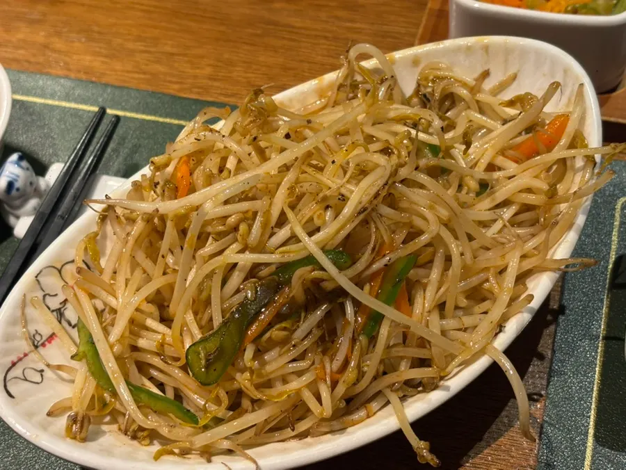 A plate of grilled beansprout stir-fry served first