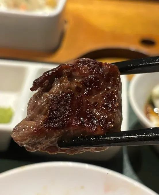 A thick cut of lamb sirloin grilling