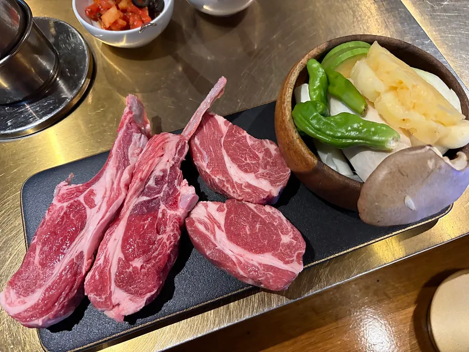 Shoulder rack and lamb sirloin on the charcoal grill