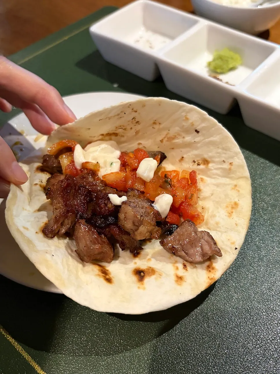 Taco with grilled lamb wrapped in a tortilla