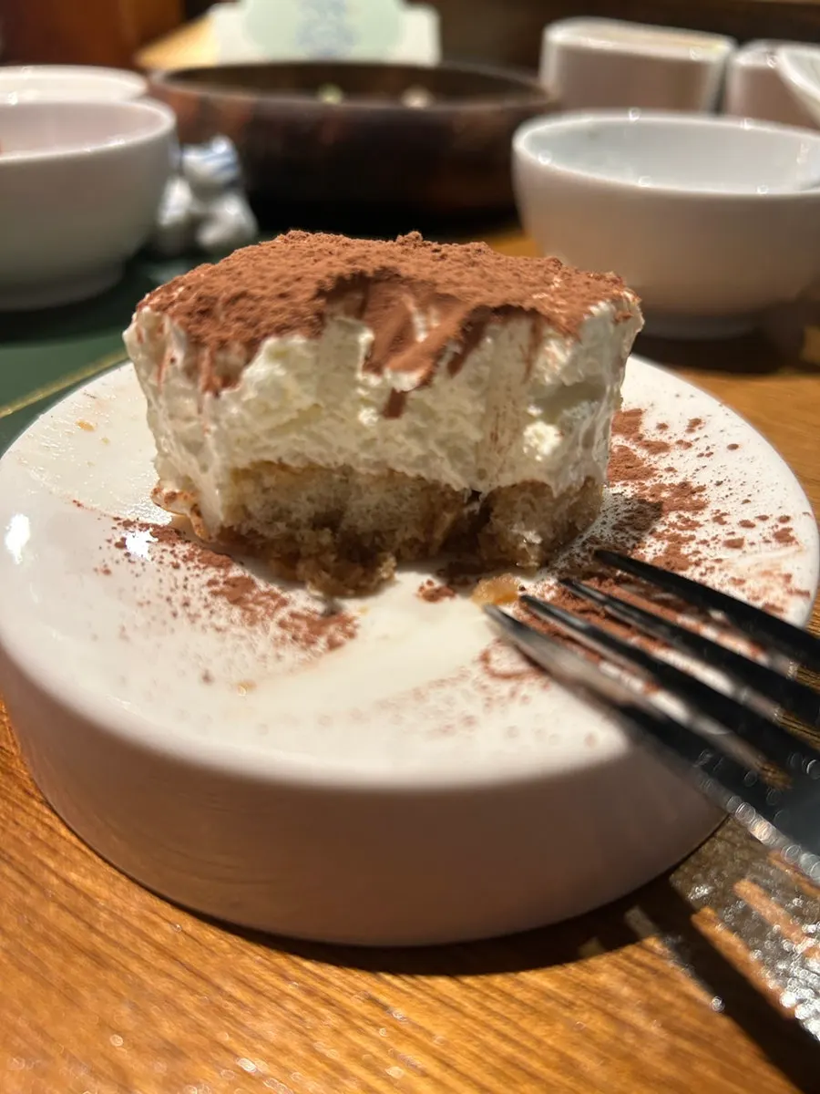 Handmade tiramisu topped with cocoa powder