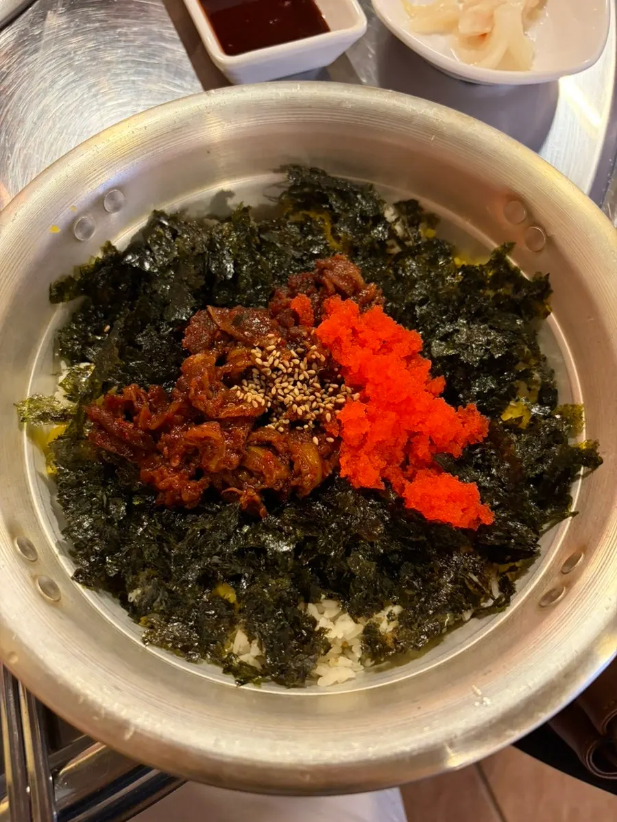 Chiletan rice ball topped with flying fish roe and seaweed flakes