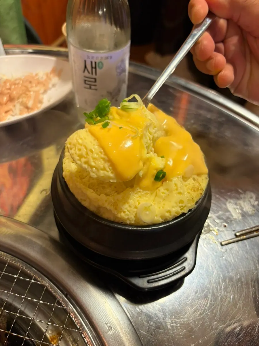 Bomb steamed egg topped with cheddar cheese